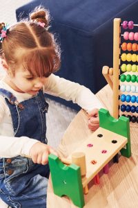 cheerful-little-girl-in-casual-clothes-playing-in-2CHG2VH.jpg