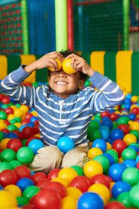 happy-kids-playing-in-ball-pit-VE6XSWK.jpg